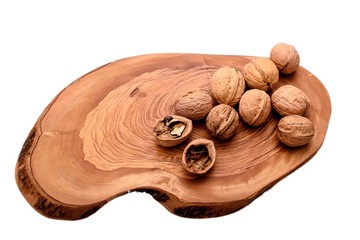 Walnut on wooden board isolated on white background