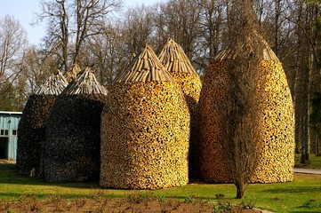 Pyramid Shaped Stacks of Firewood 