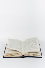 Open book on white background.