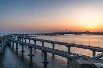 Fototapeta na wymiar cross the sea highway bridge part,Dalian,China at dusk.