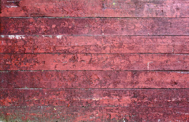 Extremely worn red wood panel