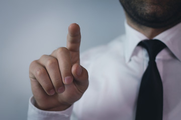 Businessman touching screen.