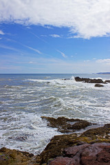Waves breaking at rocks