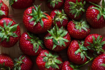 Berries strawberries with leaves healthy natural texture background.