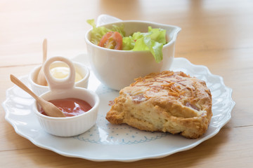 Fototapeta na wymiar Scones with cheddar and bacon with Vegetable Salad