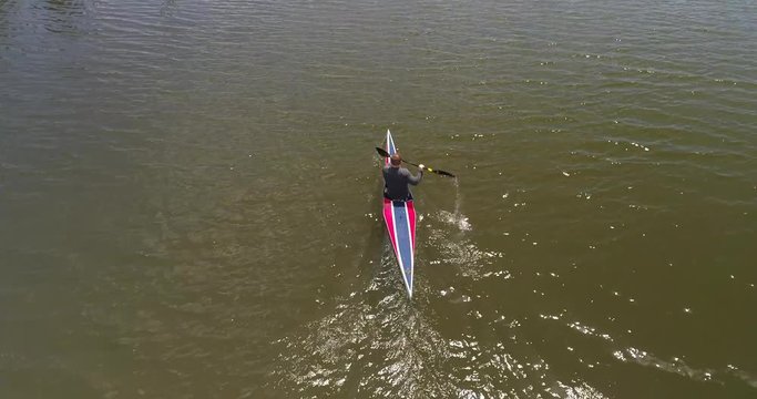 Amazing Kayak Aerial Shot Close Up Above Racer as He Glides Across Water at High Speed