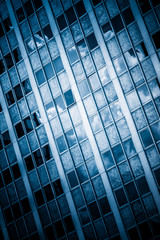 Fototapeta na wymiar detail shot of modern architecture facade,business concepts in blue tone,shot in city of China.