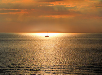 Single boat in the harbour sunset