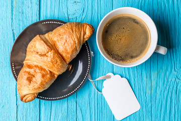 Bun, coffee and blank paper