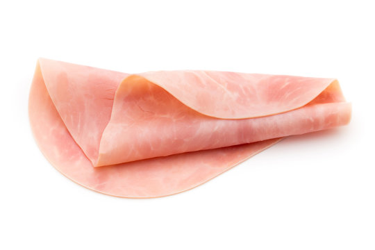 Thin slices of ham on white background.