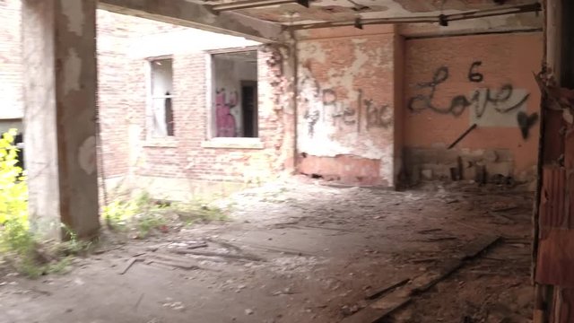 HYPERLAPSE, TIMELAPSE, FPV: Running through crumbling dirty rooms and narrow dark corridors in scary abandoned house with fragile weathered floors and collapsing ceilings. Debris in decaying building