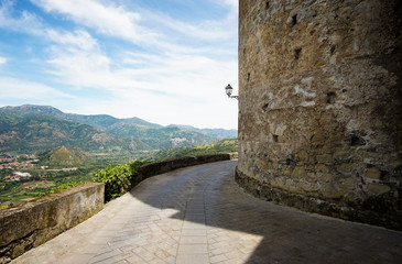 Fototapeta na wymiar Road near walls of Lauria Castle (Castello di Lauria, Castle of Roger of Lauria) in Castiglione di Sicilia village in Sicily