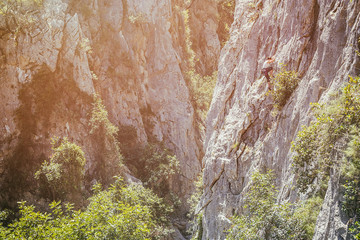 Climbing on sunny rocks