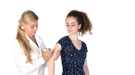 female blonde doctor with vaccine syringe