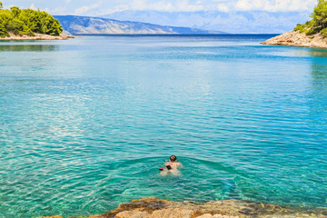 Young woman swimming in the sea