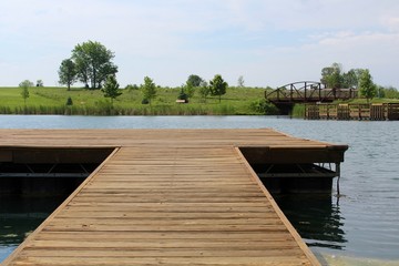 The wood dock going out in the water.