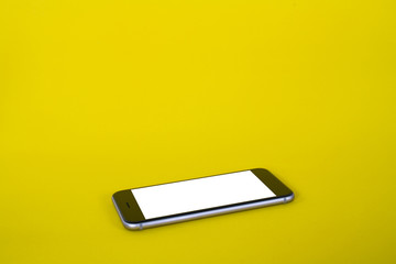 Smartphone on yellow background
