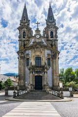 Fototapeta na wymiar Igreja de Nossa Senhora da Consolacao e Dos Santos Passos (Sao Gualter Church) in the Old City of Guimaraes, Portugal. The church was built in 18th century with Baroque style and Rococo decoration.