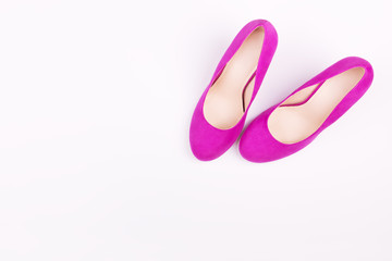 Purple female shoes on a white background. Concept idea for blog. Flat lay, fashion trendy background.