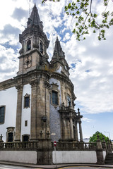 Fototapeta na wymiar Igreja de Nossa Senhora da Consolacao e Dos Santos Passos (Sao Gualter Church) in the Old City of Guimaraes, Portugal. The church was built in 18th century with Baroque style and Rococo decoration.