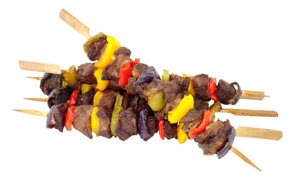 Barbecued beef and sweet pepper kebabs isolated on a white background