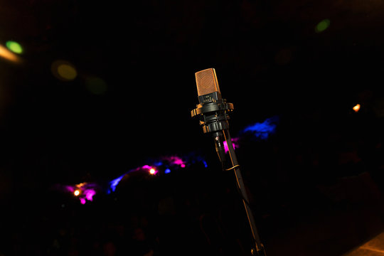 Microphone on stage. Microphone close-up. A pub. Bar. A restaurant. Classical music. Evening. Night show. European restaurant.