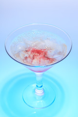 cocktail in a glass on a beautifully illuminated background