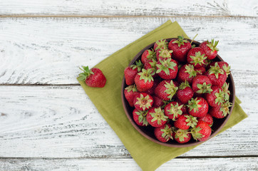 Strawberries ripe red on wooden table