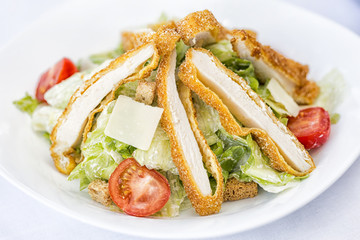 Cesar salad with roasted chicken meat