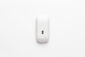 wireless computer mouse upside down on white background. not isolated