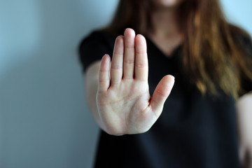 Woman's hand showing reject or stop. - obrazy, fototapety, plakaty