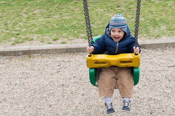 Happy child on swing