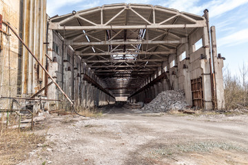 Industrial landscape. Destroyed building. The abandoned shop of the metallurgical plant