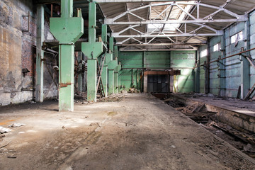 Fototapeta na wymiar Industrial landscape. Destroyed building. The abandoned shop of the metallurgical plant