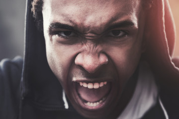 Close up of an angry African American guy