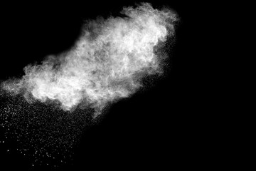 White powder explosion isolated on black background