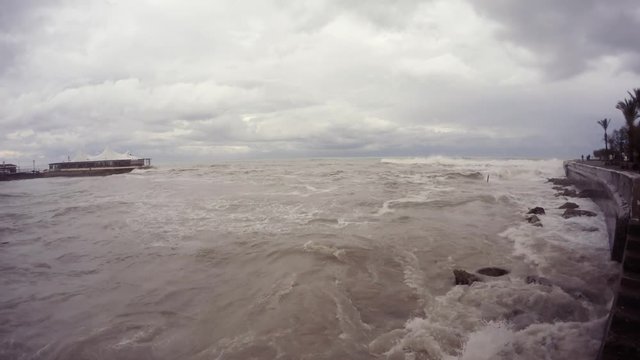 Cloudy Winter Day Waves Wash Stones on Quay of Girne