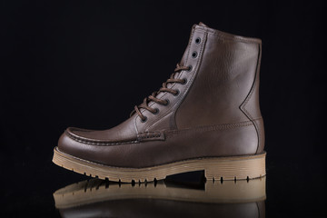 Male Brown Boot on Black Background, Isolated Product, Top View, Studio.