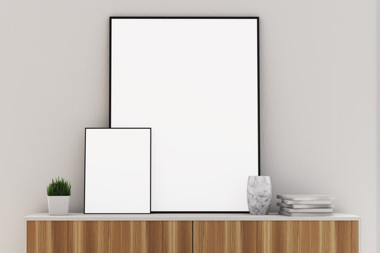 Two vertical posters on a closet, white