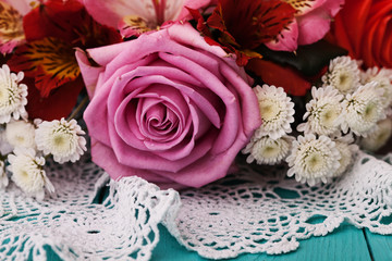 Roses on wooden desk in a vintage style.