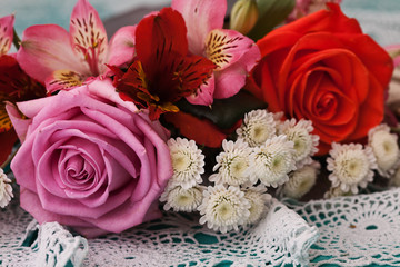 Roses on wooden desk in a vintage style.