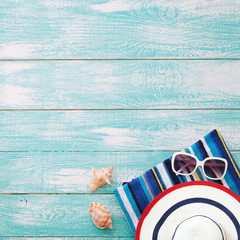 Summer fun time and accessories on blue wooden background. Mock up