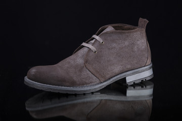 Male Brown Boot on Black Background, Isolated Product, Top View, Studio.