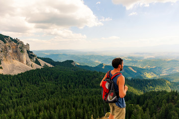 Naklejka premium Male hiker on mountain top