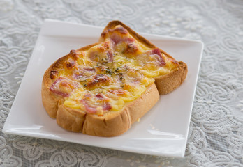 Ham cheese bread in white dish