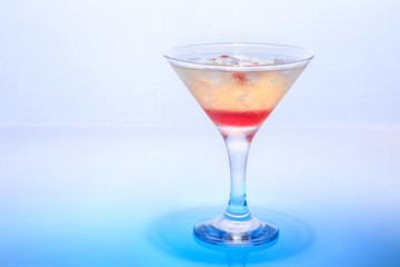 cocktail in a glass on a beautifully illuminated background