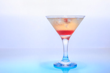 cocktail in a glass on a beautifully illuminated background