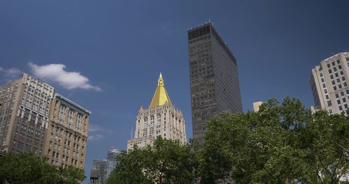 A daytime establishing shot of the skyline of Manhattan near Madison Square Park in New York City.	 	