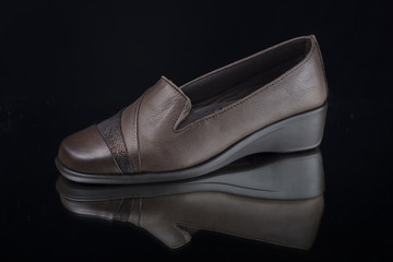 Female Brown Shoe on Black Background, Isolated Product, Top View, Studio.