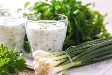 Ayran with fresh herbs. Traditional Turkish yoghurt drink.